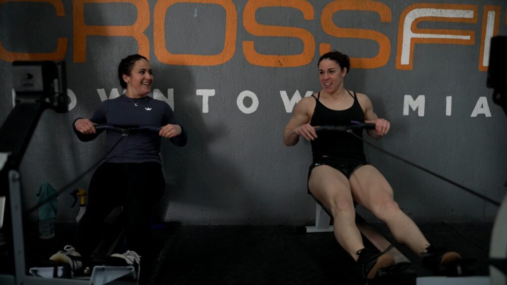 crossfit games competitors caroline conners and paige semenza on c2 rower machine